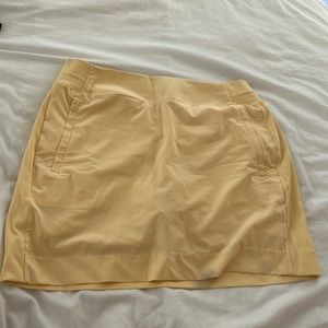 Athleta yellow work out skirt with built in shorts.